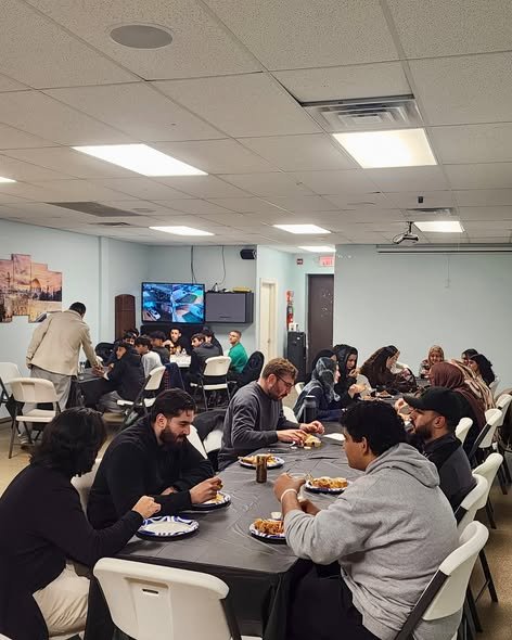 Community members sharing a meal at Beit Anan Community Center